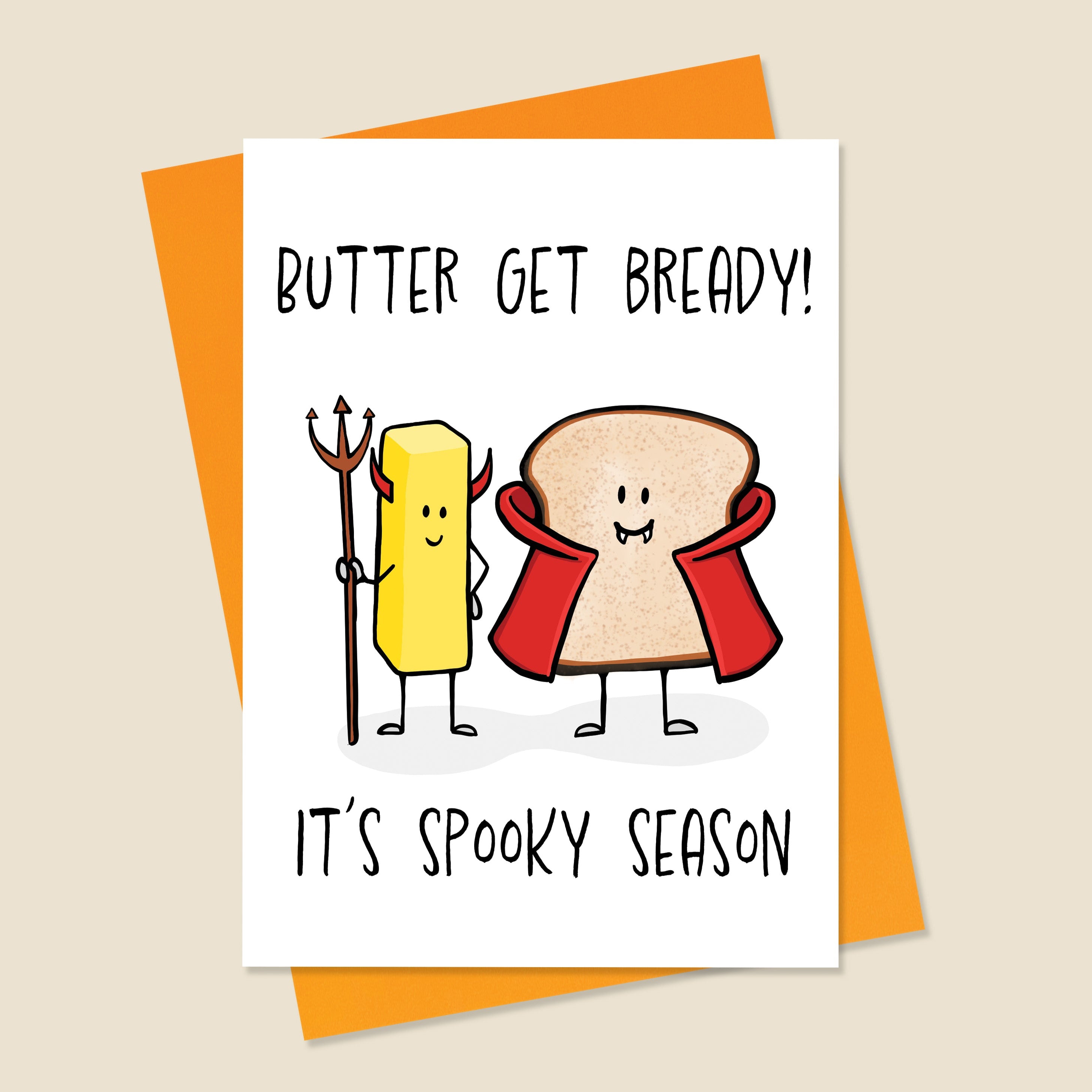 Card with cartoon characters of butter and bread with text 'Butter get bready! It's spooky season' on an orange envelope.