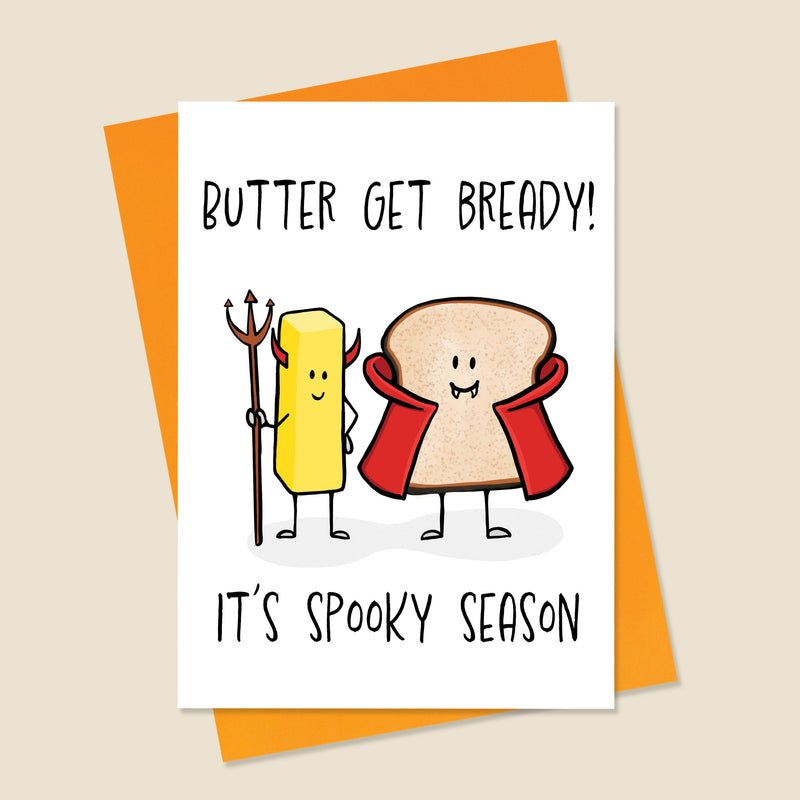 Card with cartoon characters of butter and bread with text 'Butter get bready! It's spooky season' on an orange envelope.